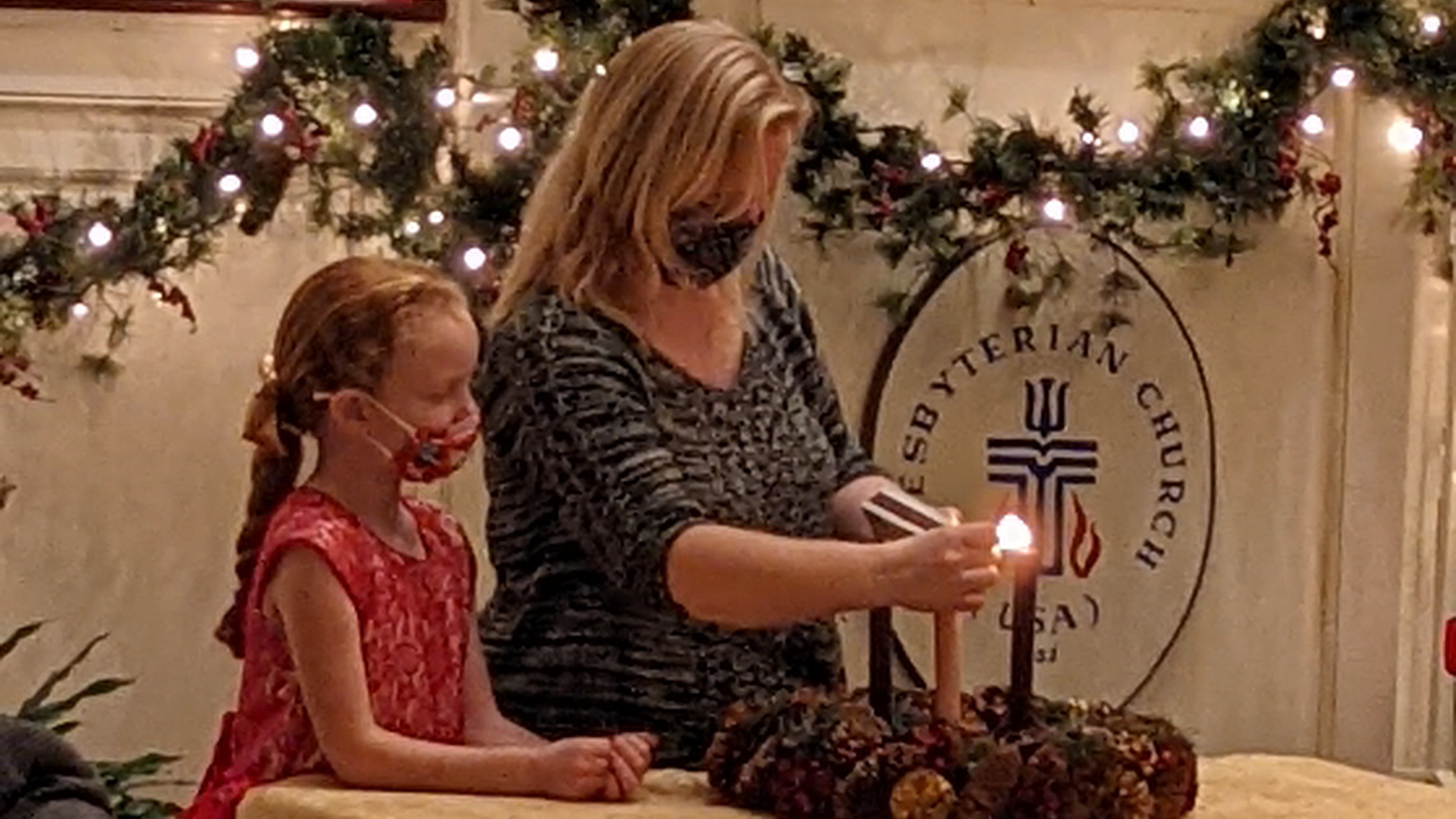 Child Lighting Candle